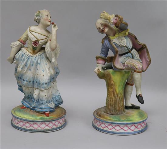 A pair of coloured bisque figures